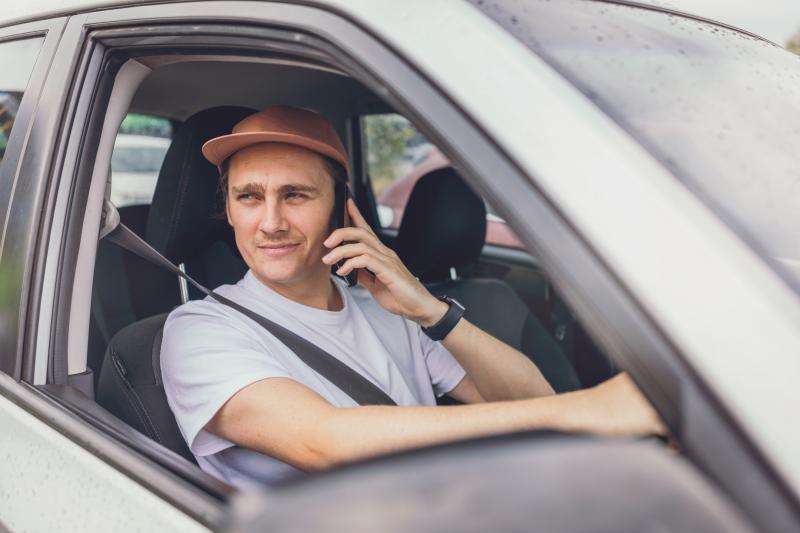 Driver Talking On Mobile Phone While Driving